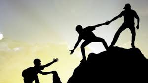 Photograph of climbers helping each other